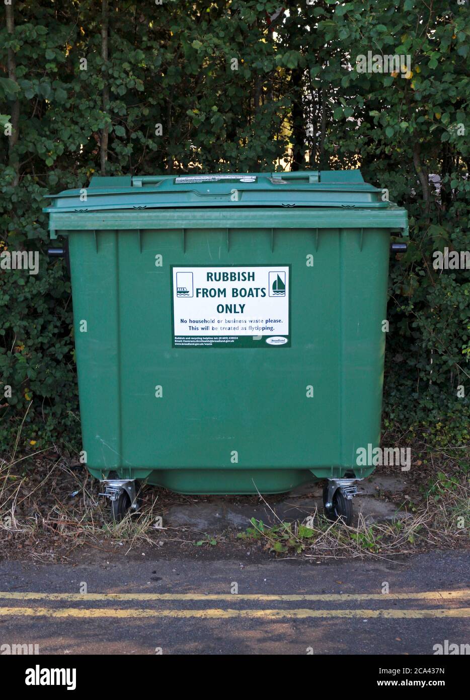 A bin provided for Rubbish from Boats Only by moorings on the the Norfolk Broads at Coltishall Common, Coltishall, Norfolk, England, United Kingdom. Stock Photo