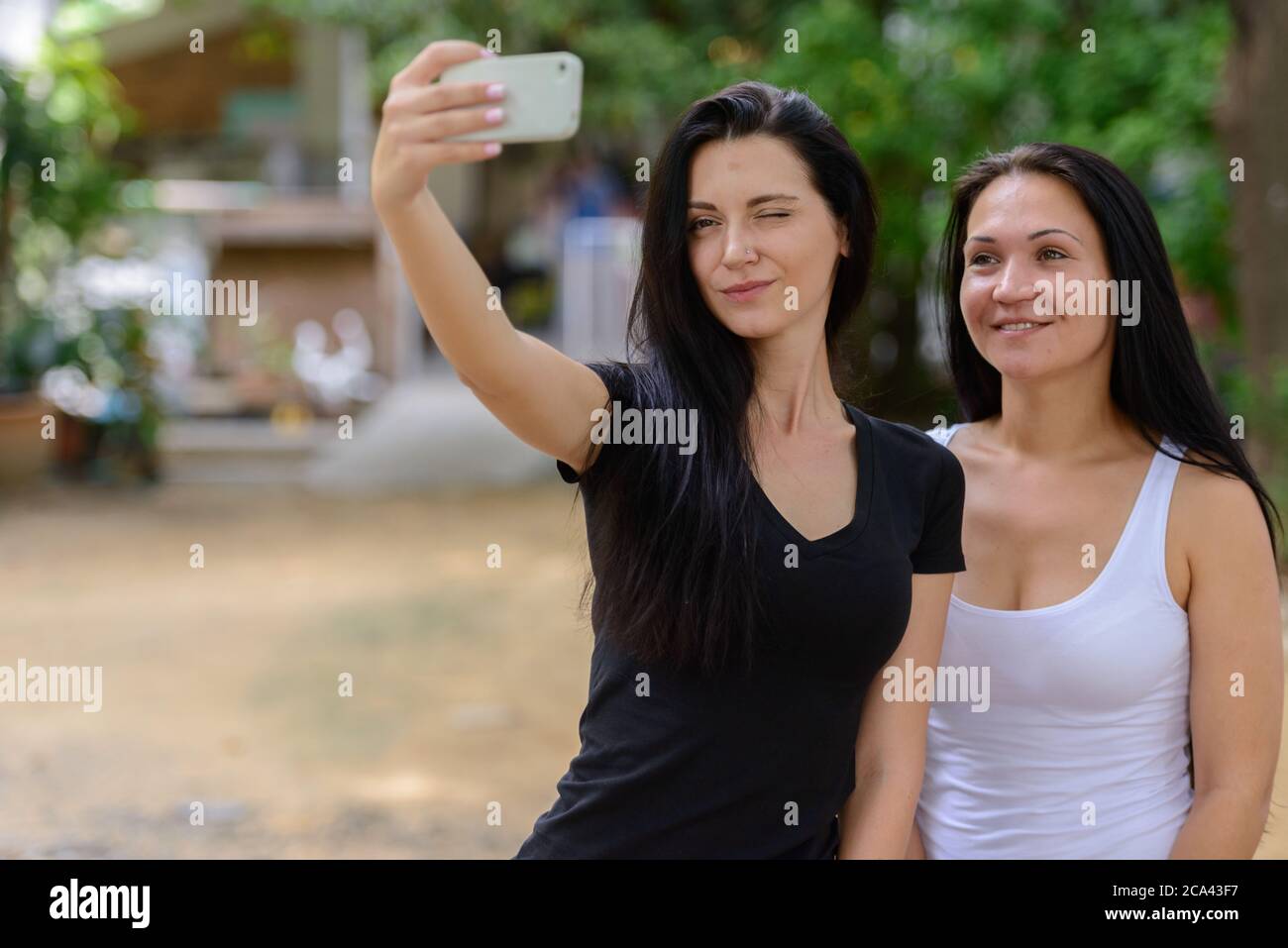 Video two beautiful women using hi-res stock photography and images - Alamy