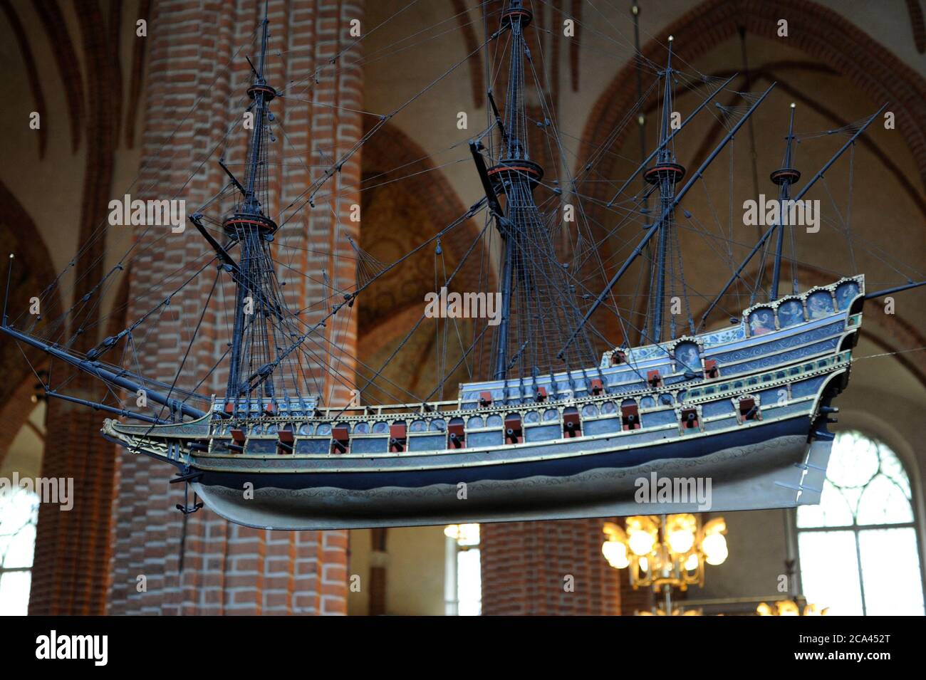 Sweden, Stockholm. English Galleon, 16th century. Votive ship hanging from the ceiling of the Cathedral of Saint Nicholas. One of the oldest votive ships in the world. This ship model is a copy of the original made in 1950s. The original ship model was built around 1600, today kept in the Museum of Maritime History in Stockholm. The ship-type is an Elizabethan galleon, as at the end of the 15th century. Stock Photo