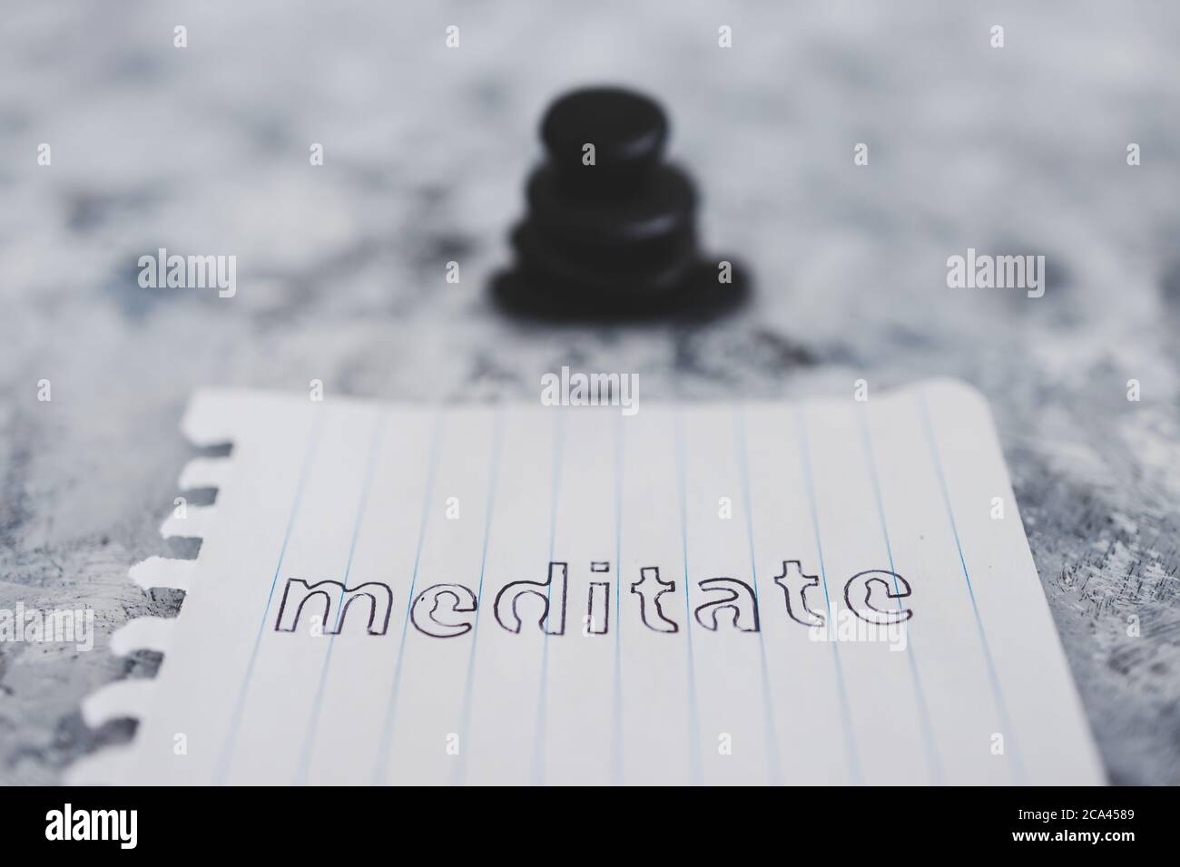 mental health concept, notepad with text Meditate on zen pebbles on ...