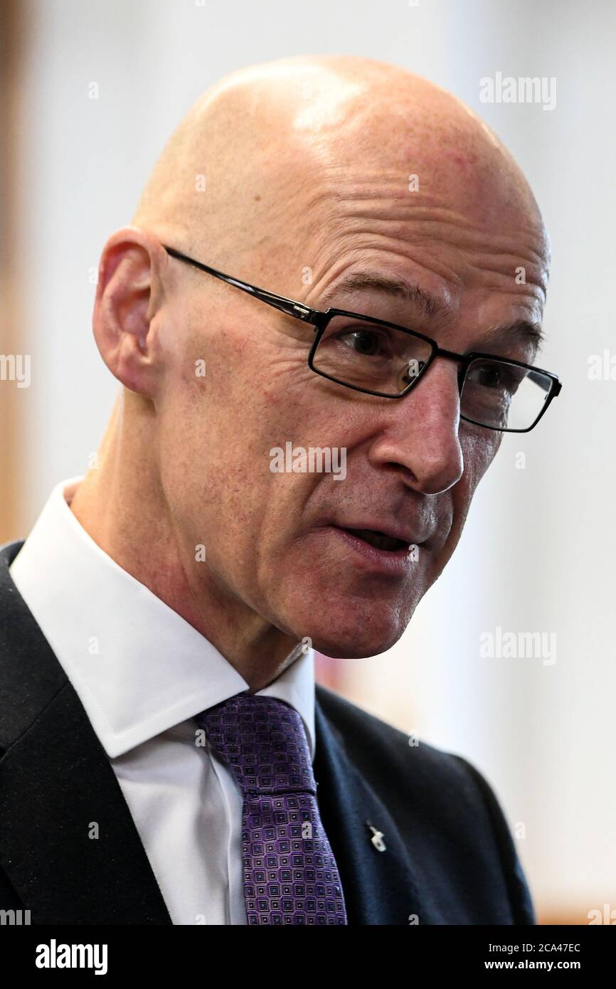 Deputy First Minister of Scotland and Cabinet Secretary for Education and Skills John Swinney during a visit to Stonlelaw High School in Rutherglen, Glasgow, on the day pupils are finding out their Scottish Qualifications Authority (SQA) grades. Stock Photo