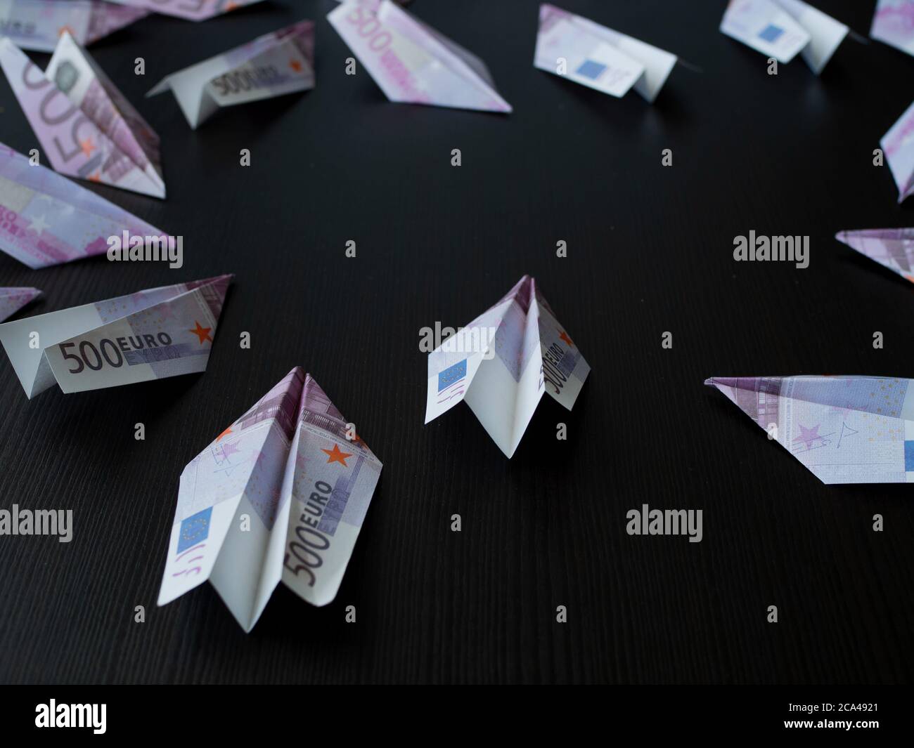 Paper airplanes made of Euro banknotes, the concept of cash flow. Global financial crisis, debt on loans, concept. Stock Photo