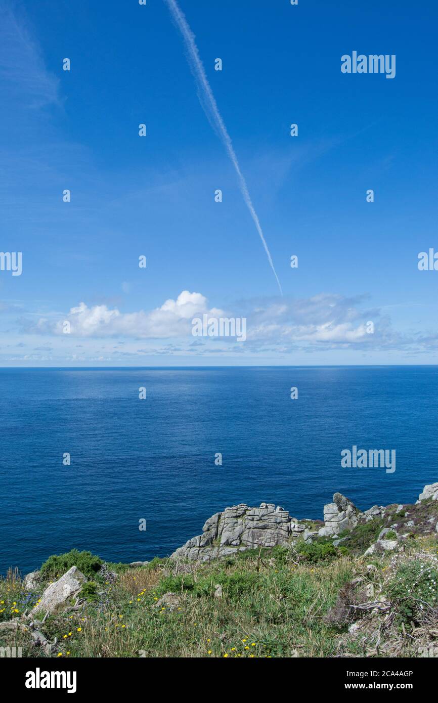 Contrail above the Bosigran Settlement, aka the Bosigran Castle Promontory Fort, Cornwall UK Stock Photo
