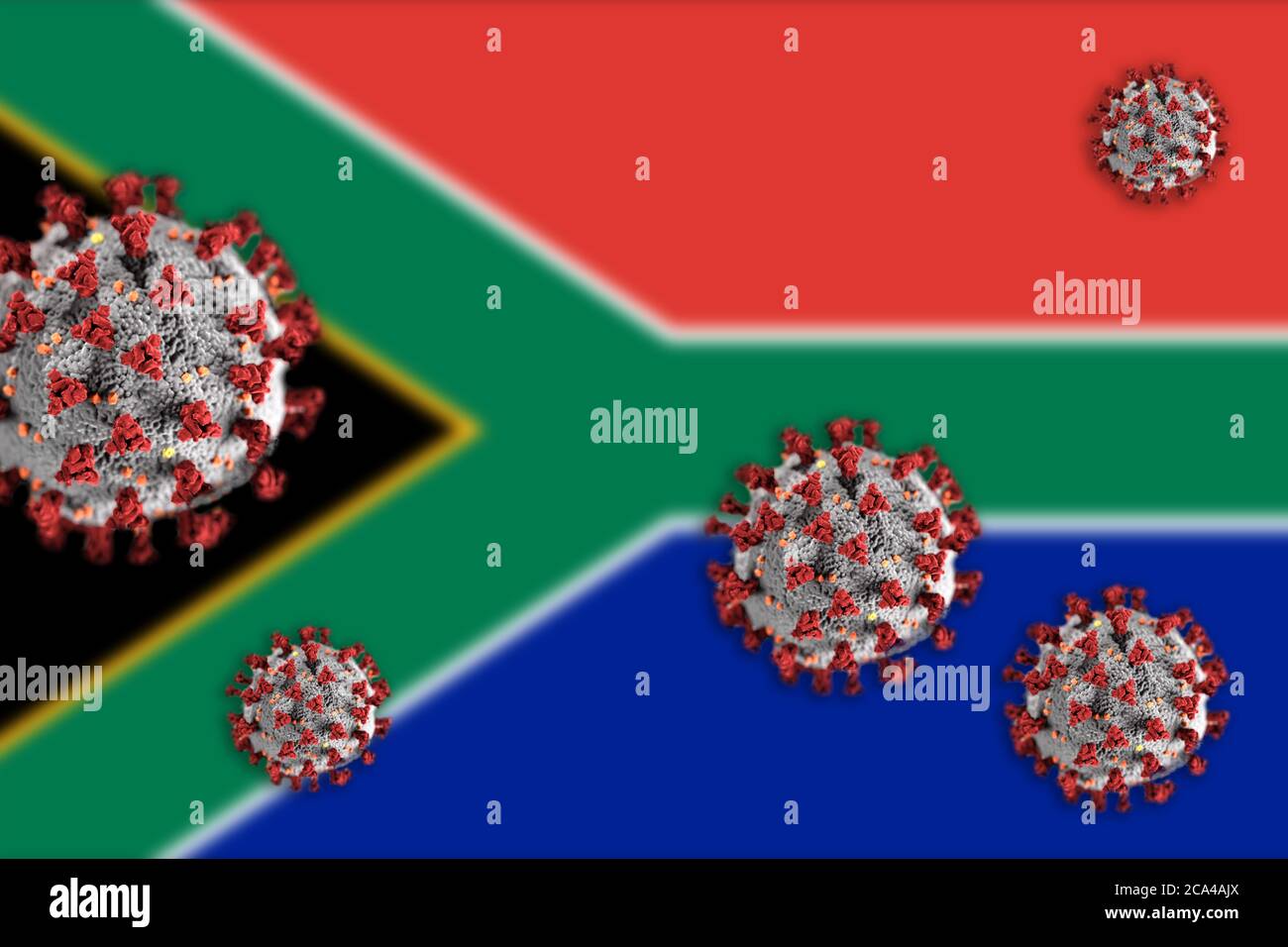 Concept of Coronavirus or Covid-19 particles overshadowing blurred flag of South Africa in background. Stock Photo