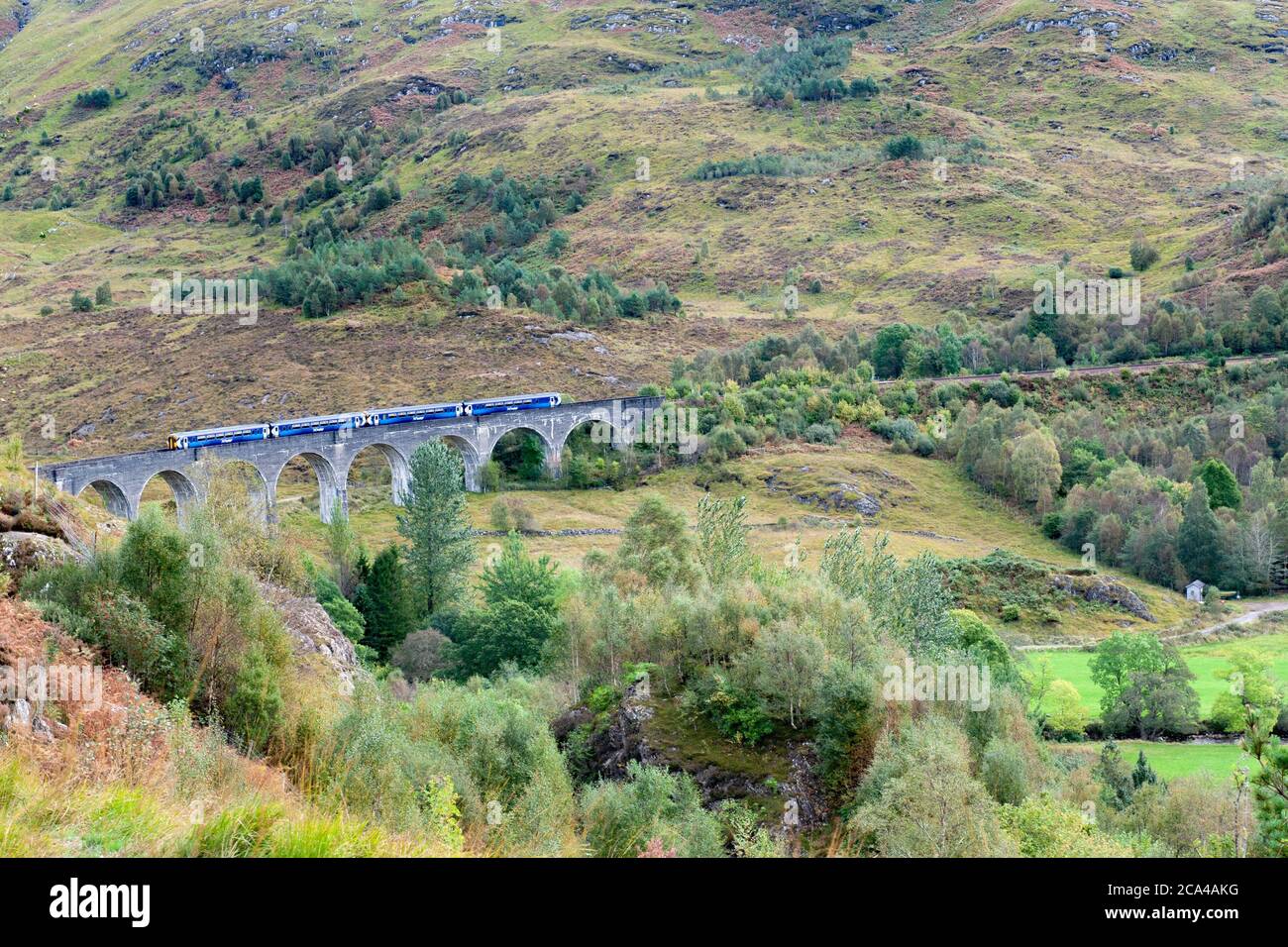 Glenfinnan, Scotland, UK - 04 October, 2019. Train on Glenfinnan viaduct, Viewpoint , Glenfinnan viaduct trail , Scottish Stock Photo
