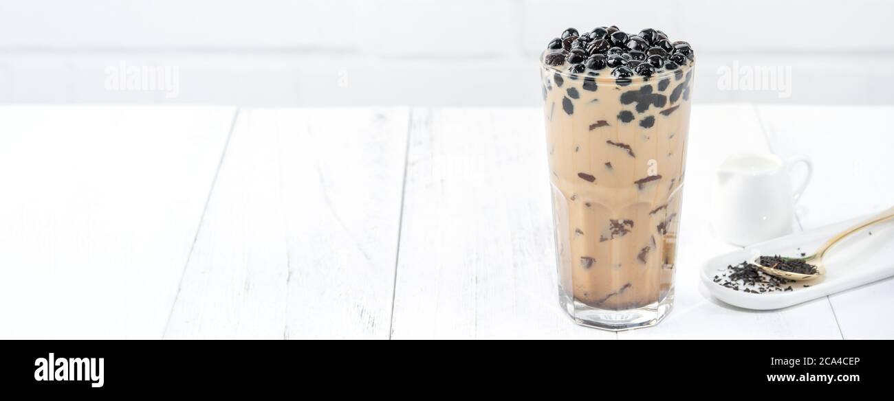 A glass cup of pearl milk tea (also called bubble tea) and a plate of  tapioca ball on white background. Pearl milk tea is the most representative  drin Stock Photo - Alamy