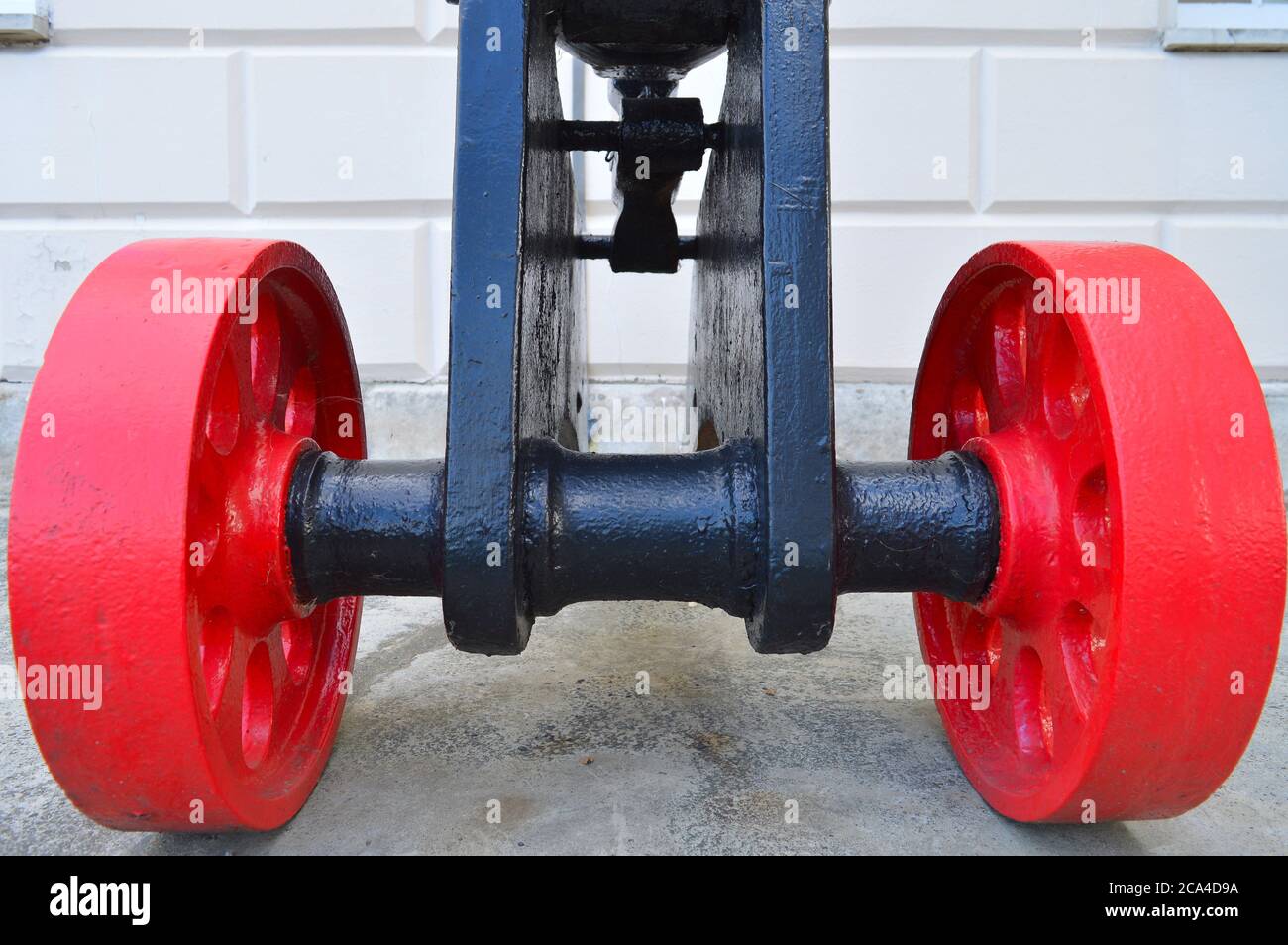 Red wheels of a cannon Stock Photo