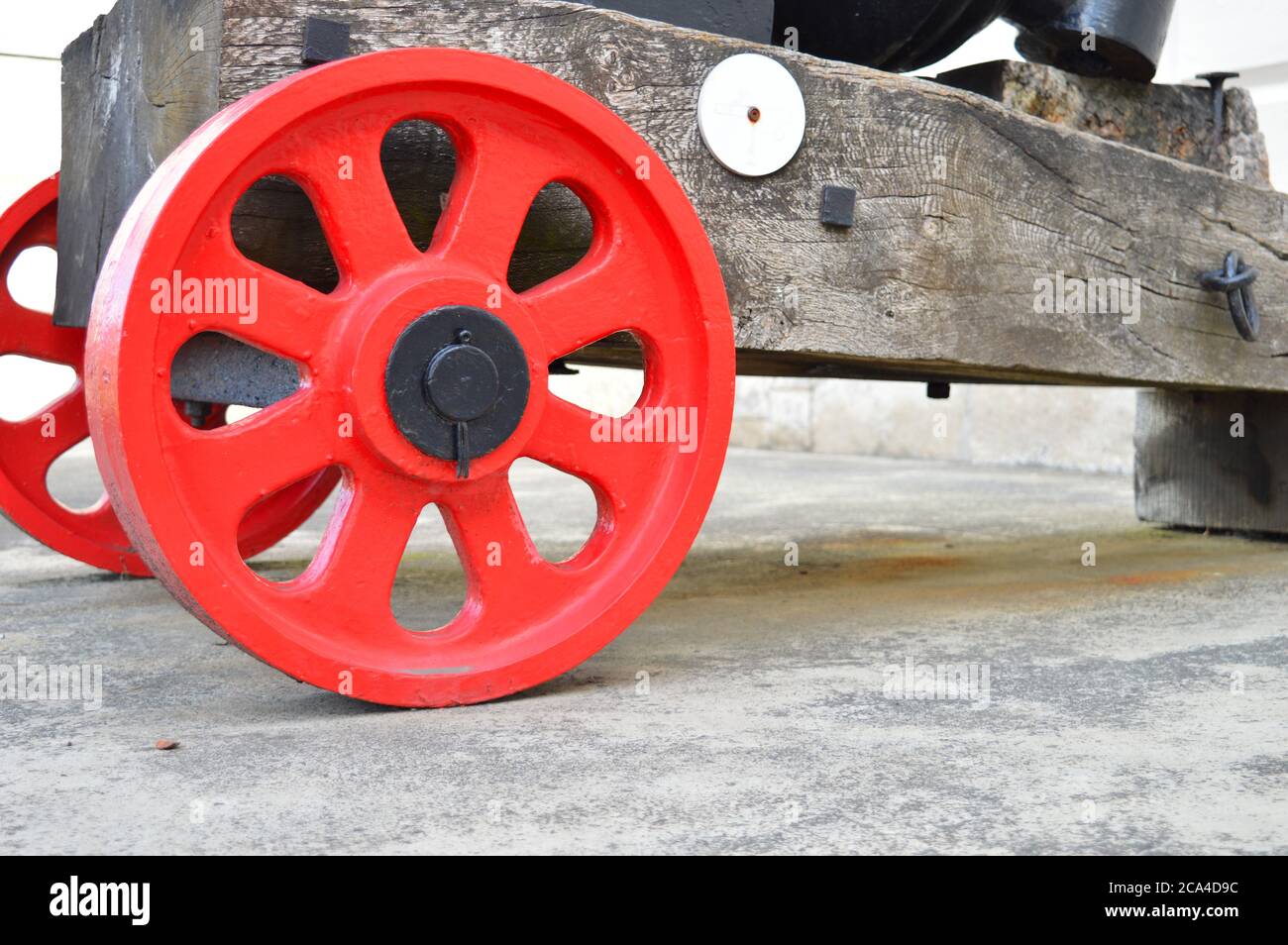 Red wheels of a cannon Stock Photo