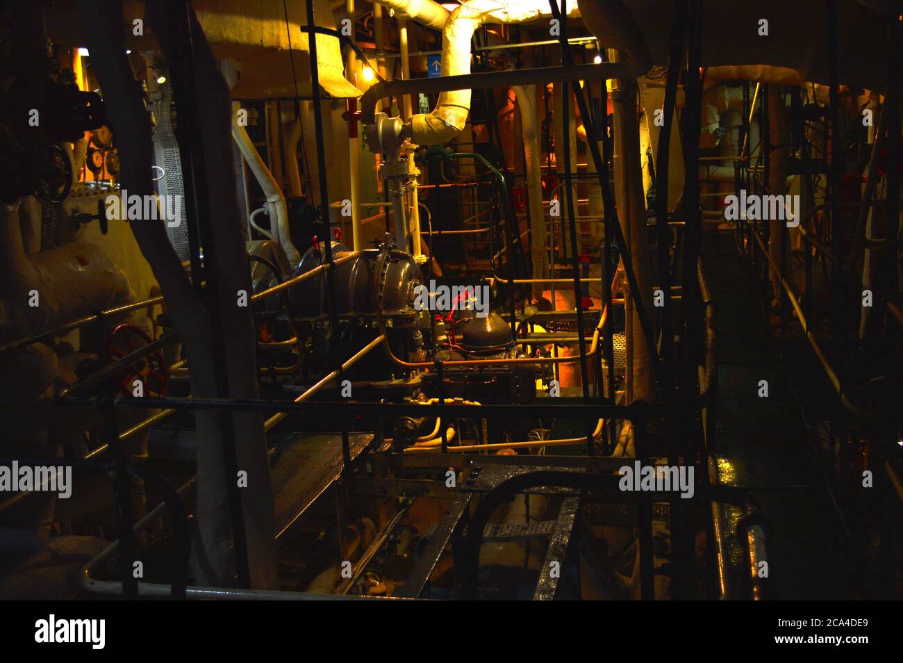 Dark engine room in a ship Stock Photo