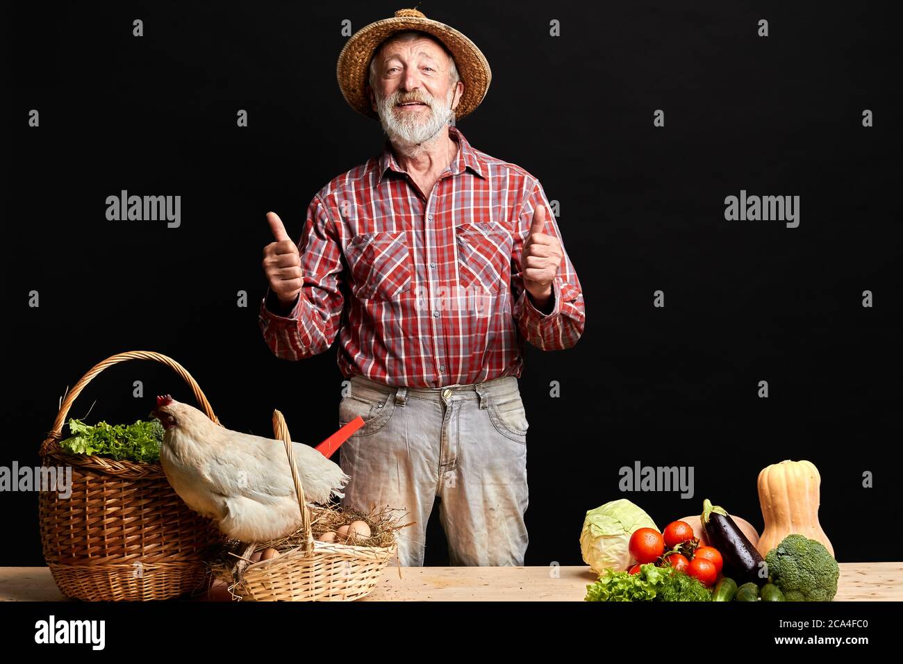 Local mature farmer presents proudly his harvest, fresh organic ...