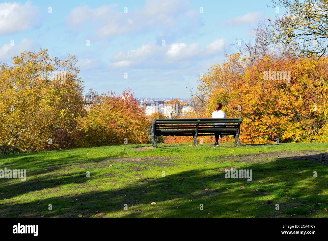 Girl sitting on top hill hi-res stock photography and images - Alamy