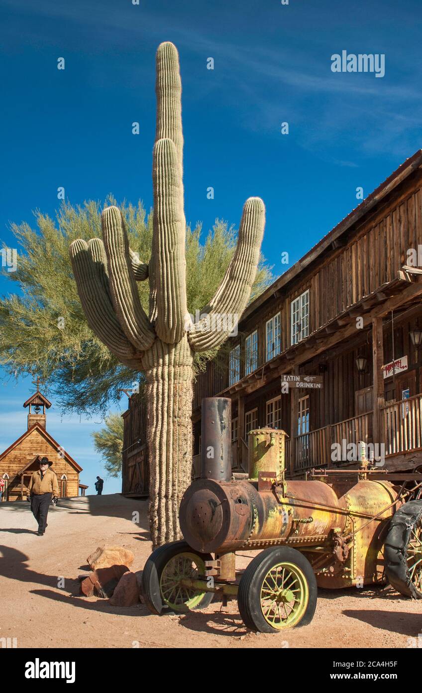Steampowered traction engine, 19th century tractor, at street in ghost
