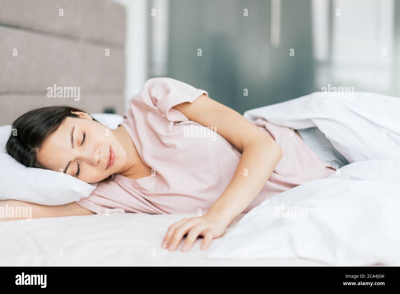 good looking girl sleeping in the bed, good night . healthy sleep, health care Stock Photo