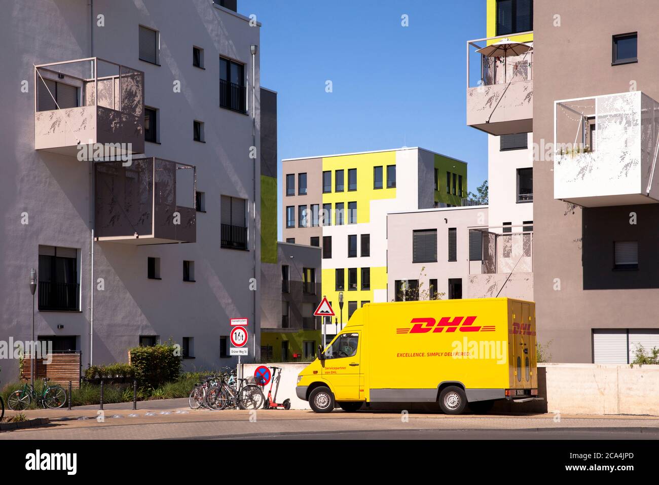 the Kubikon quarter of the GAG Immobilien AG in the Ehrenfeld district of Cologne, DHL parcel service car, Germany.  das Stadtquartier Kubikon der GAG Stock Photo