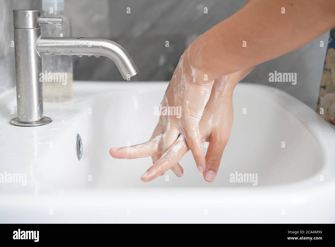 Hands washing for prevention of novel Coronavirus Disease 2019 or COVID-19 . Stock Photo