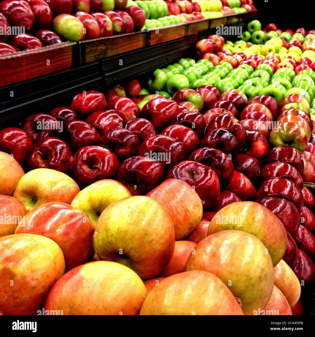 Bins of colorful apples for sale in a grocery store Stock Photo Alamy