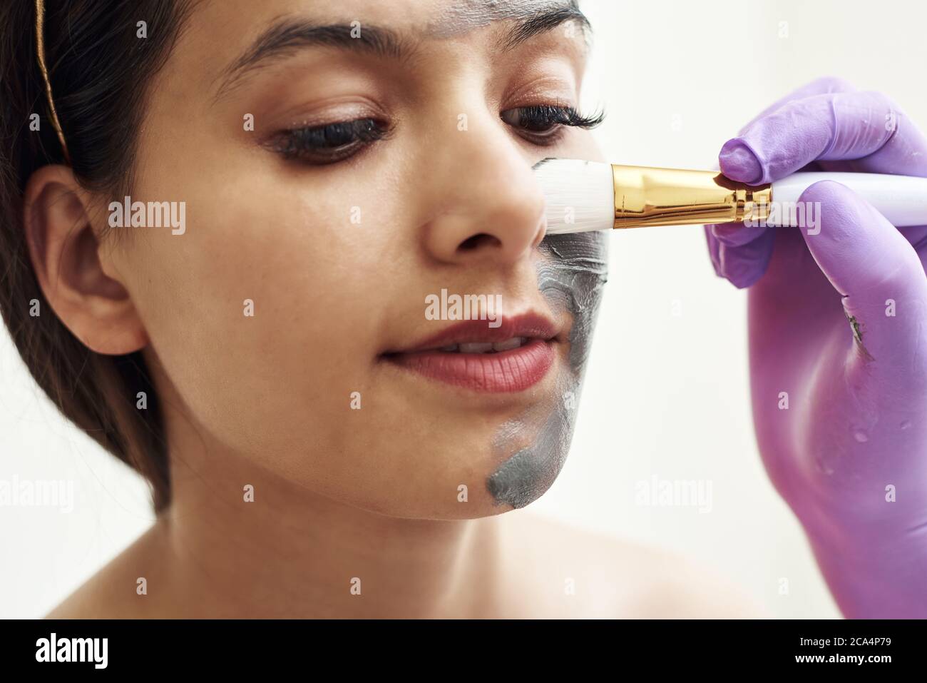 Spa beauty treatment, skincare. Woman getting facial care by beautician