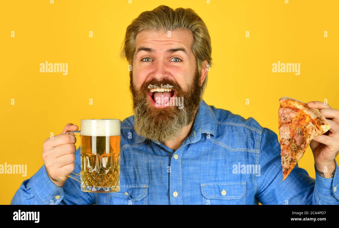 fast food. happy bearded man with beer and pizza. italian food. italy