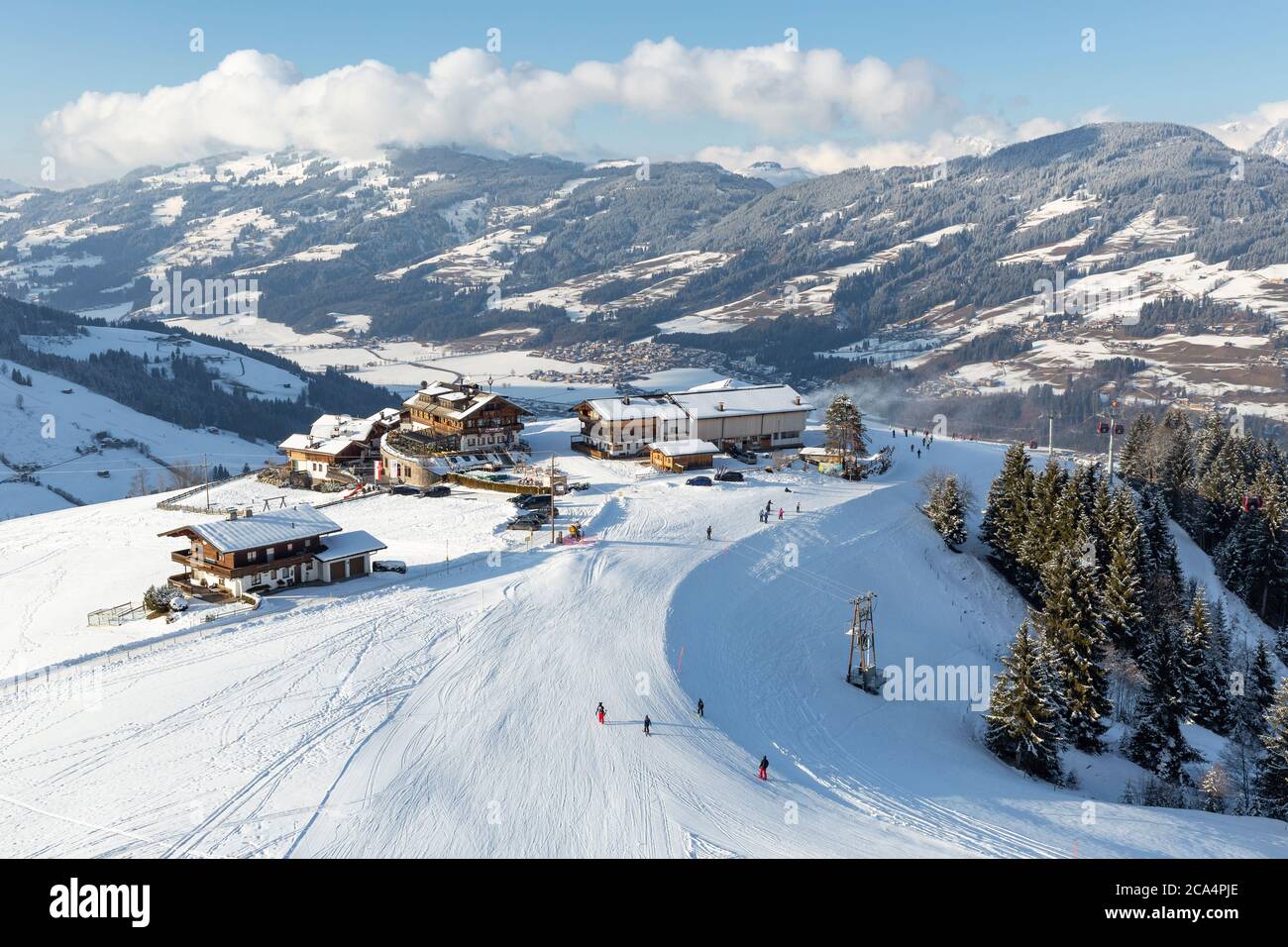 Elevated view of hotel and restaurant buildings on the slopes at Kirchberg in Tirol, part of the Kitzbühel ski area in Austria. Stock Photo