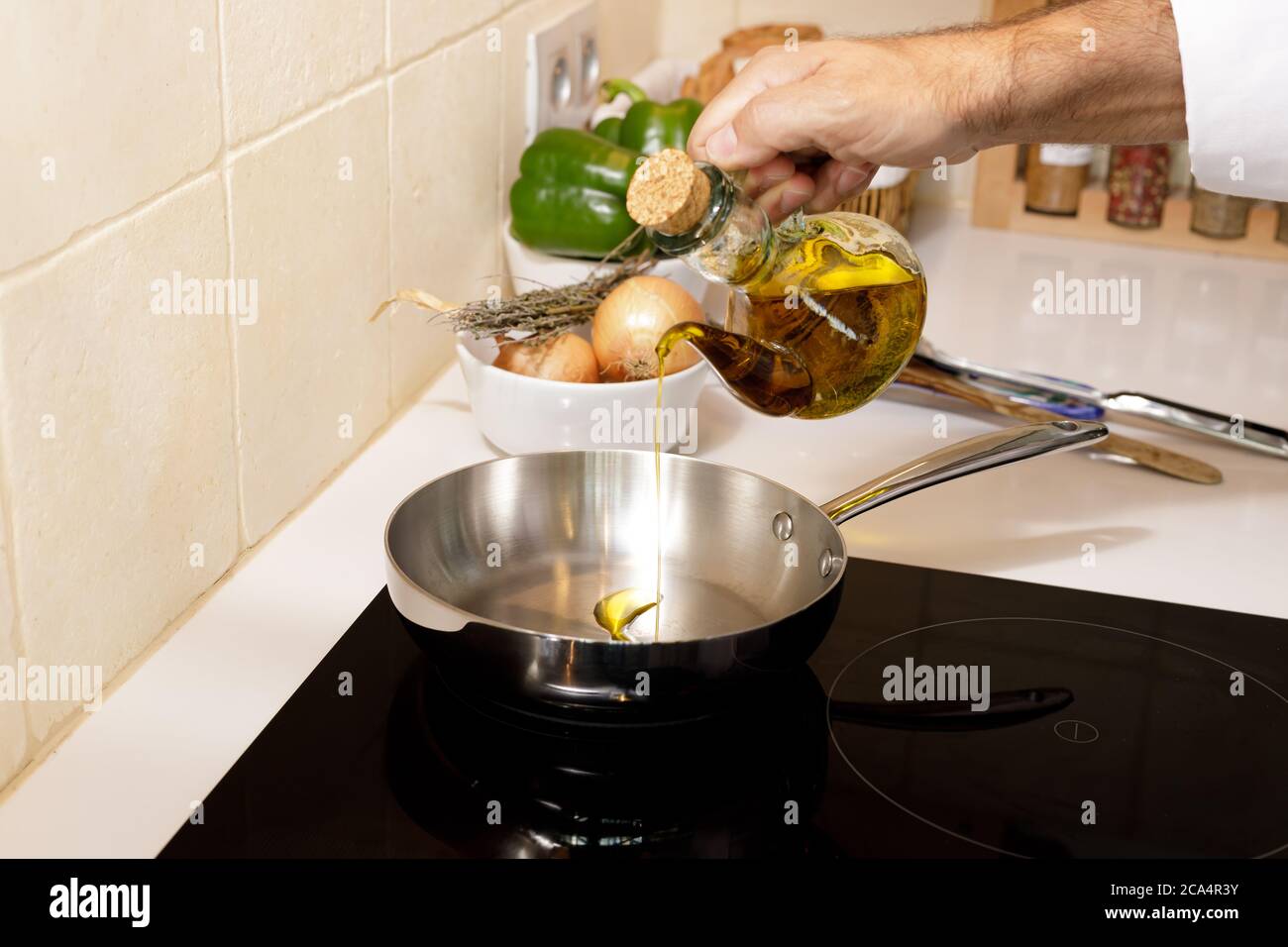 Oil pouring into a pan hires stock photography and images Alamy
