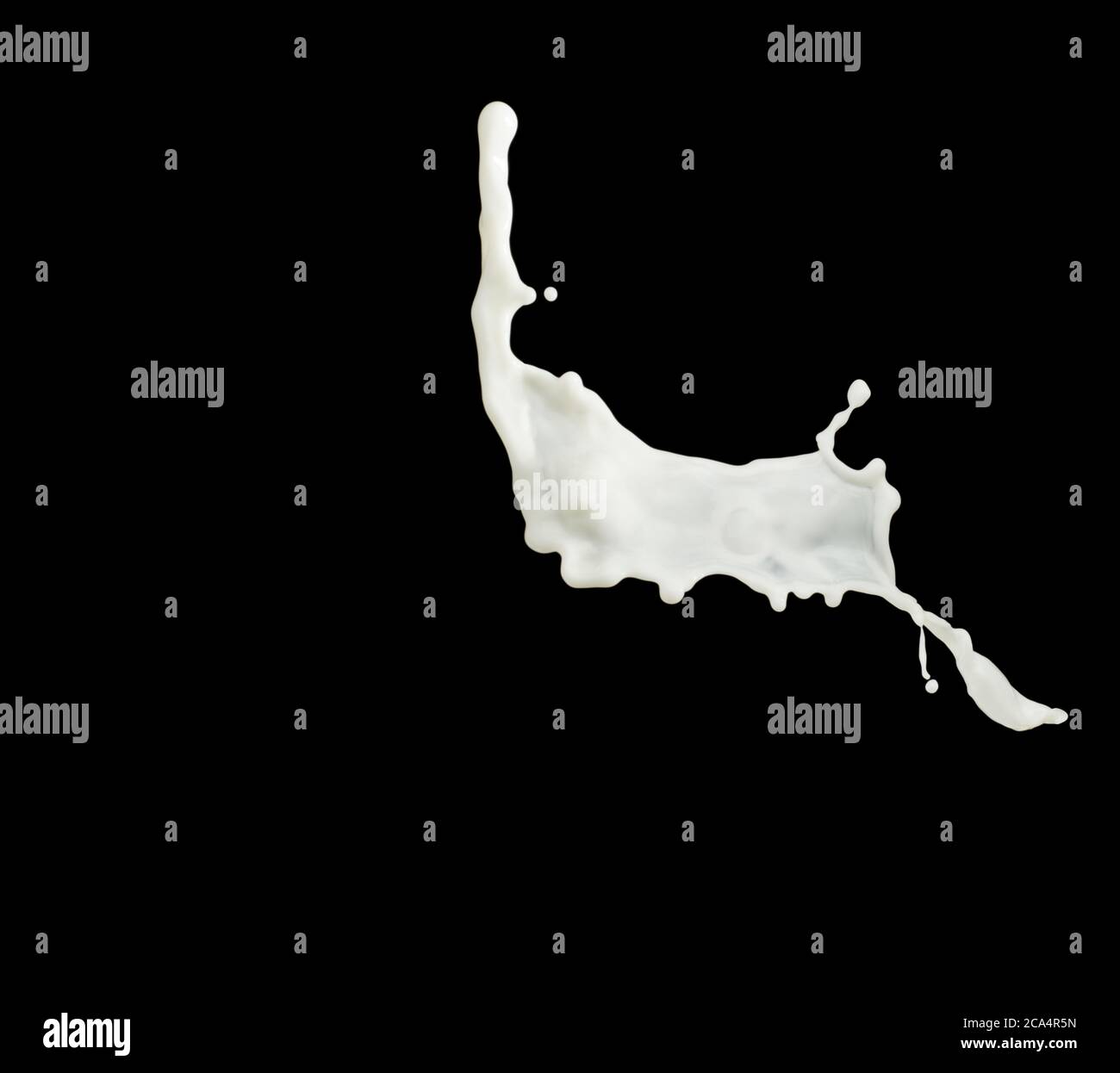 Milk splash isolated on black background Stock Photo - Alamy