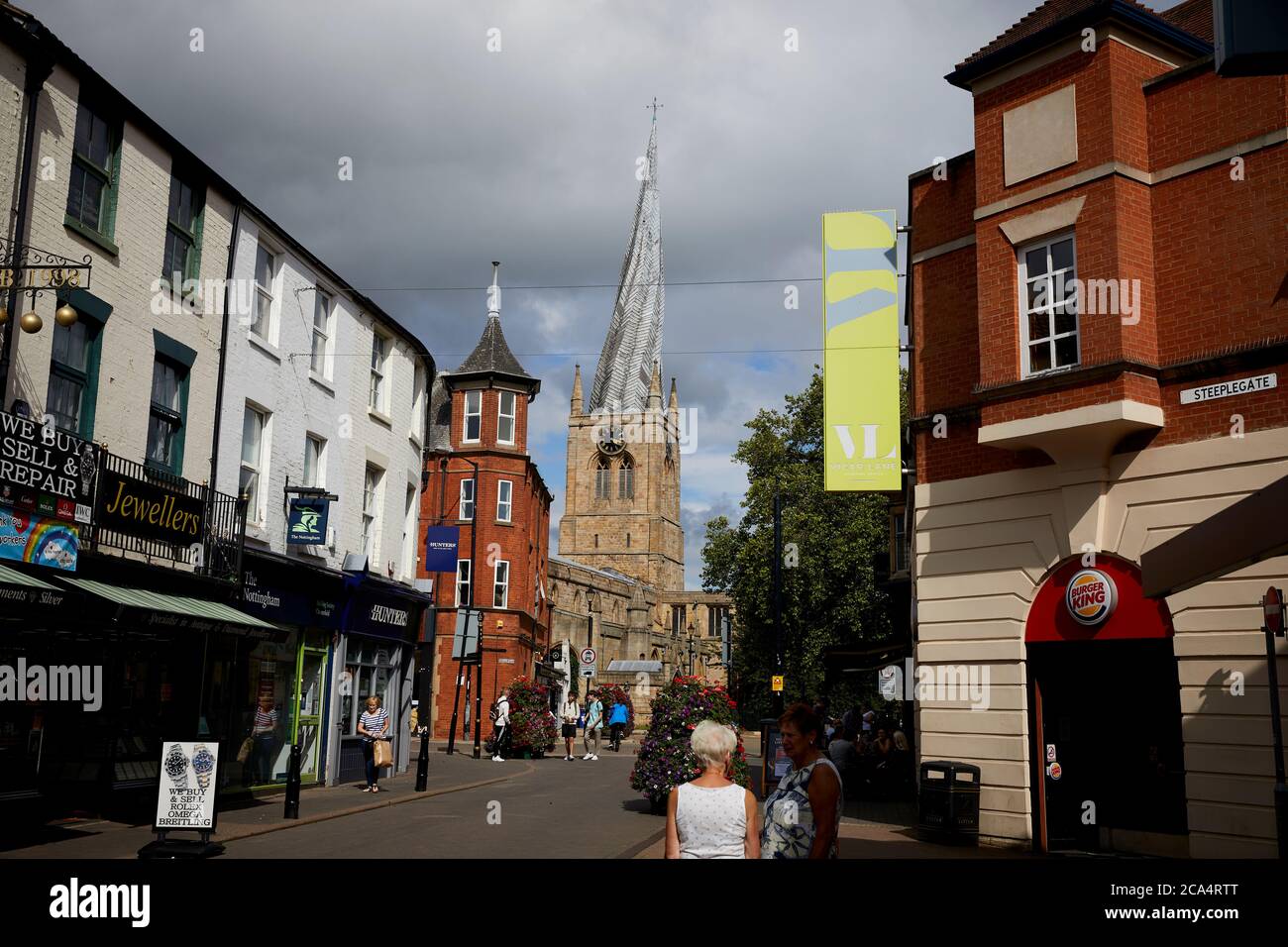 Chesterfield town centre in Derbyshire landmark Chesterfield Parish Church with iconic crooked spire from Burlington Street Stock Photo