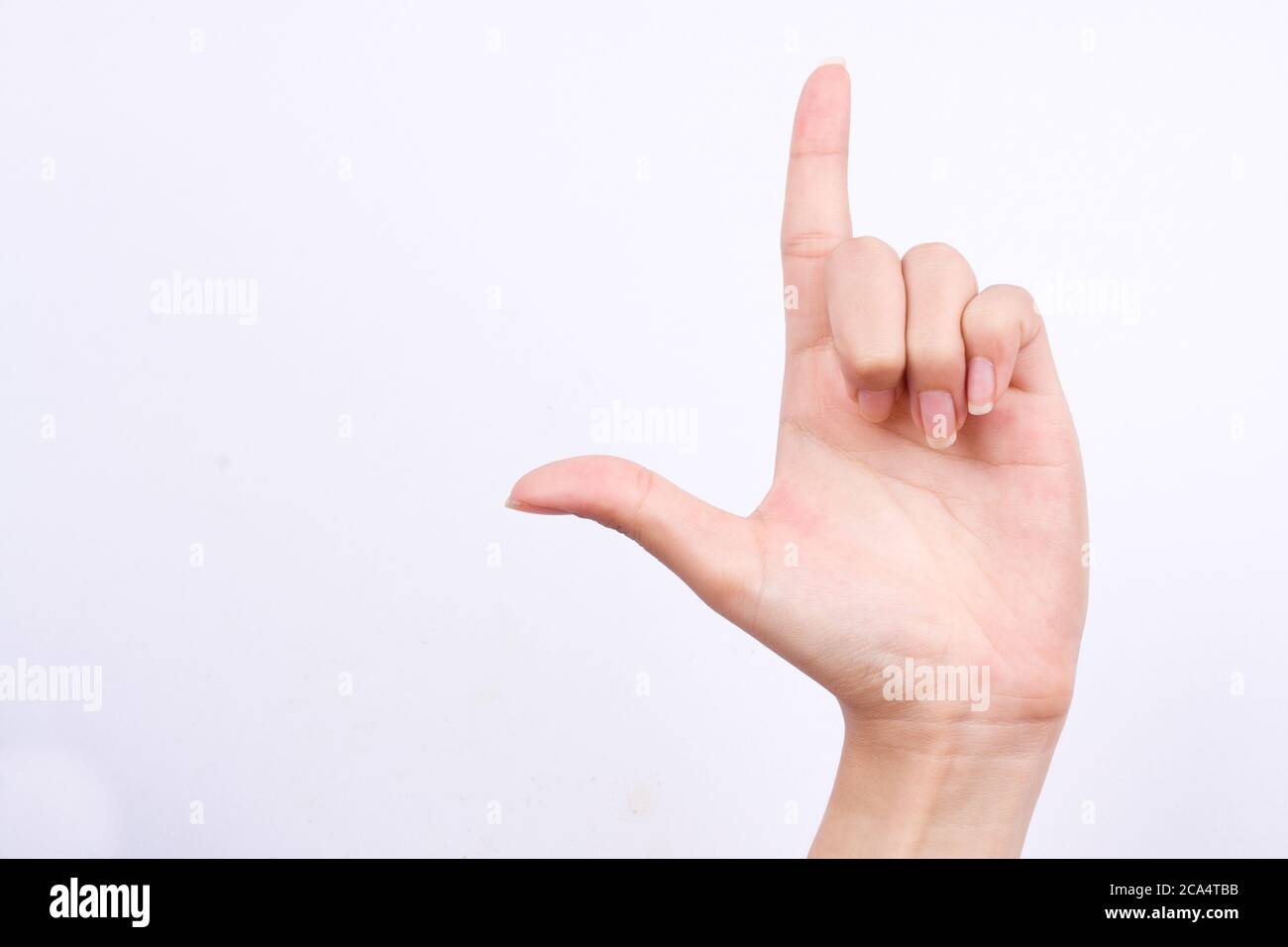 finger hand symbols isolated concept true alpha holding up the loser sign on the white background Stock Photo