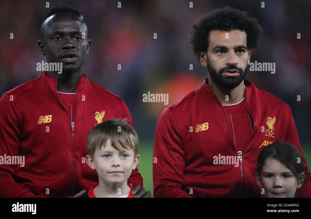 Liverpool's Sadio Mane and Liverpool's Mohamed Salah line up prior to the UEFA Champions League Group E match at Anfield, Liverpool. Stock Photo