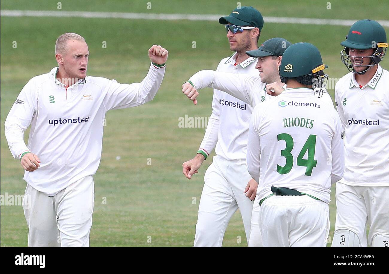 Leicestershire's Matt Parkinson (left) celebrates with teammates after taking the wicket of Lancashire's George Balderson (not pictured) during day four of the Bob Willis Trophy match at Blackfinch New Road, Worcester. Stock Photo