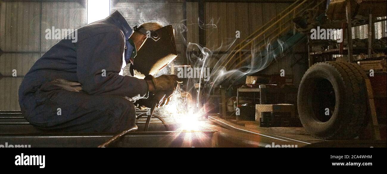 Man welding in a workshop Stock Photo