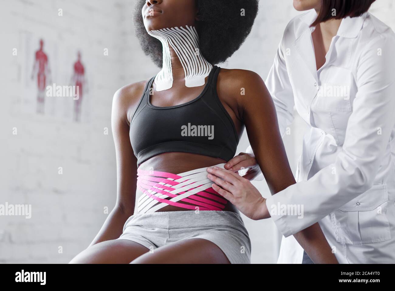 Weight loss concept.Kinesiology taping.Therapist applying kinesiology