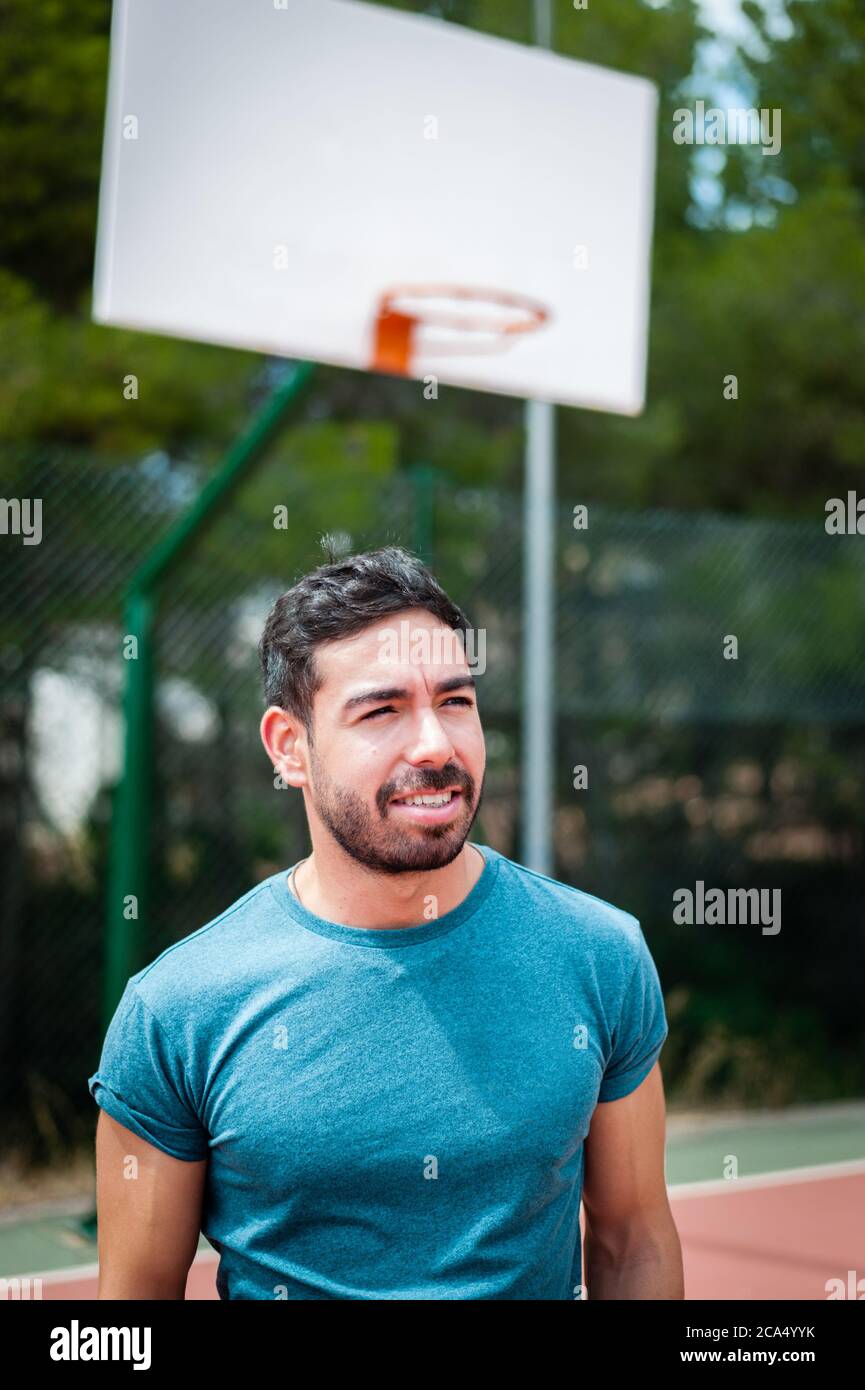 Muscle man playing basketball alone Stock Photo Alamy