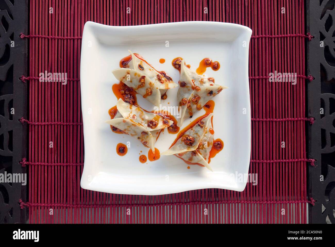 VEGETARIAN DIM SUM WITH CHILLI OIL AND SCHEZWAN SAUCE Stock Photo Alamy