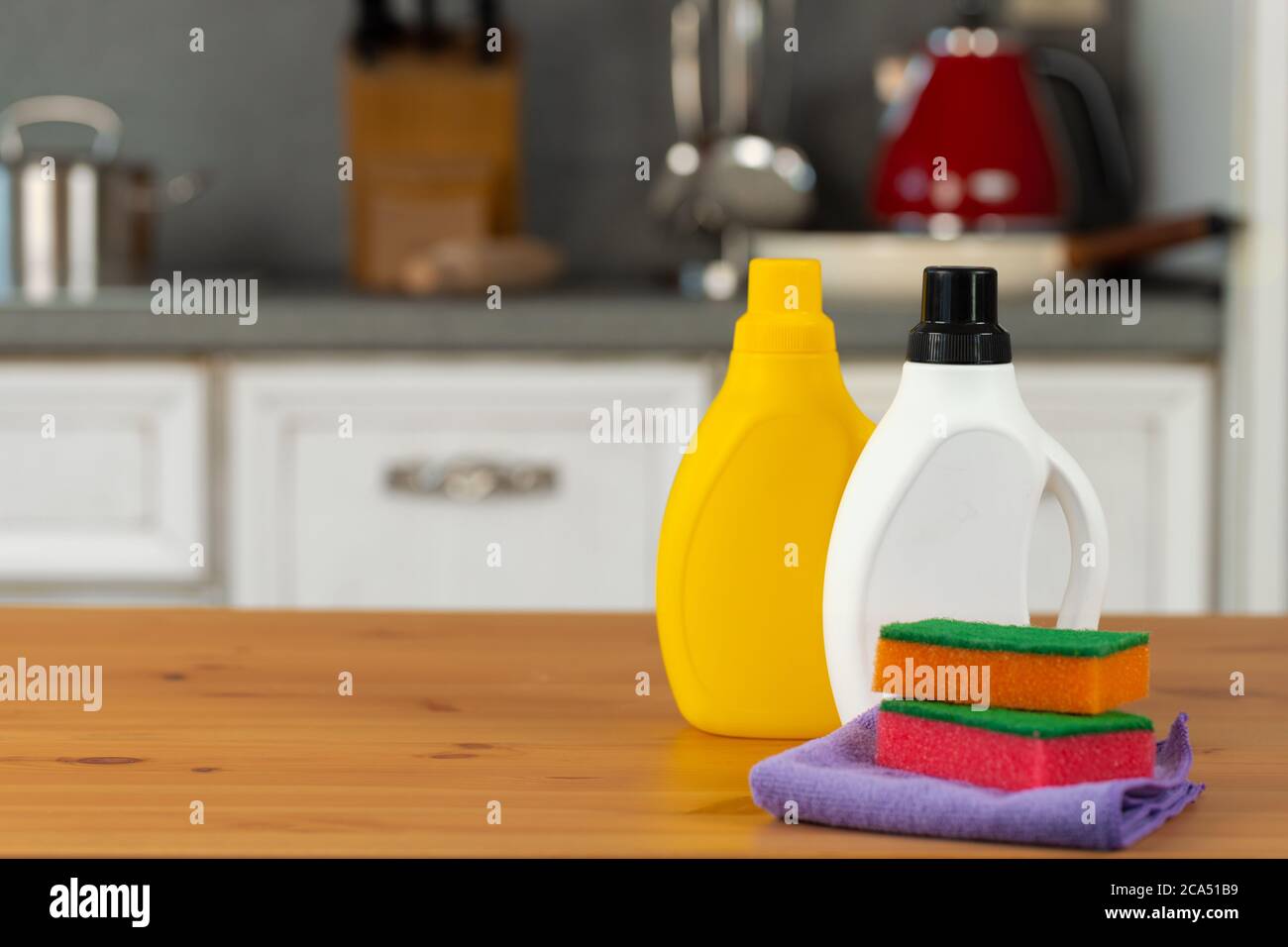 Cleaning detergents and tools on a kitchen counter Stock Photo Alamy