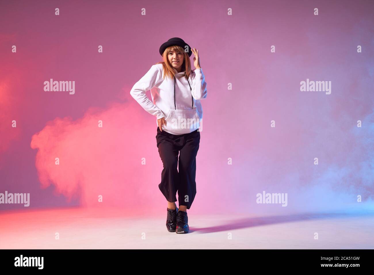 Pretty attractive female dancer performing dance element in dance show