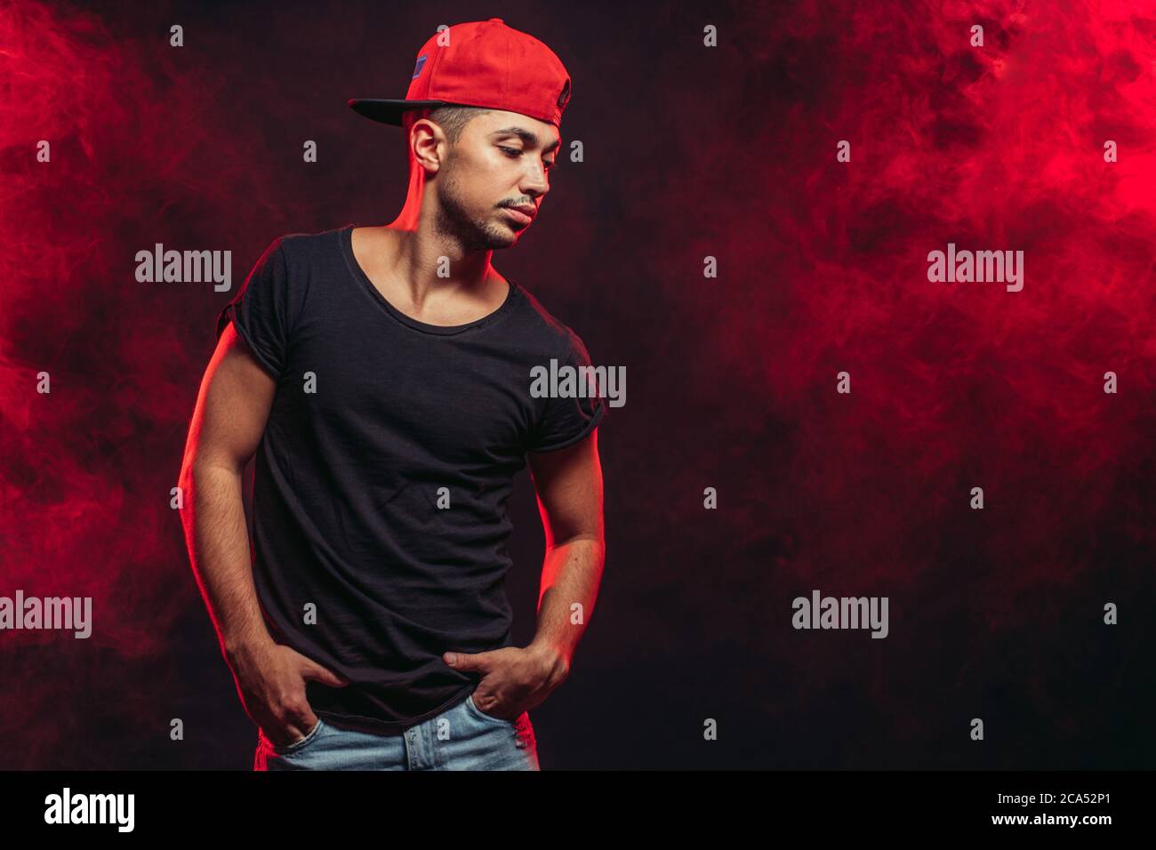 street dance, hip-hop, modern style of dancing concept. handsome stylish  dancer man wearing black t-shirt and blue jeans stand posing isolated over  re Stock Photo - Alamy