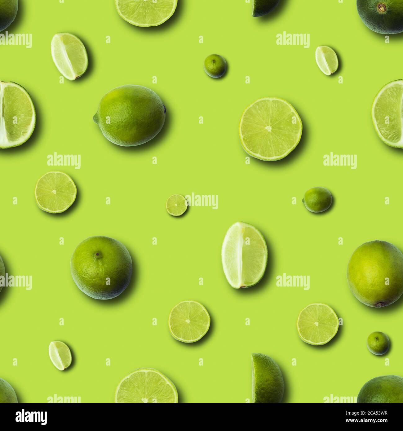 fresh slices lime on a light green background, seamless lime pattern Stock Photo