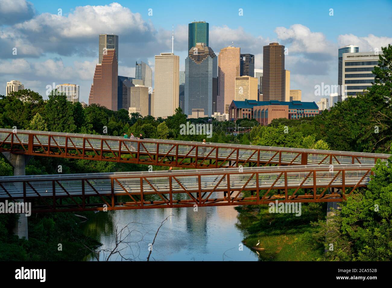 Elevated walkway over Buffalo Bayou with downtown skyline in background, Houston, Texas, USA Stock Photo