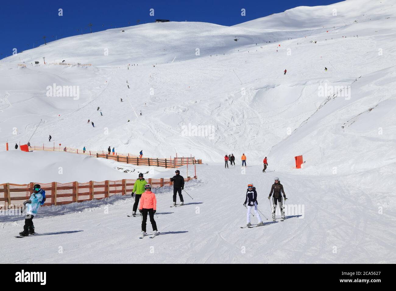 MAYRHOFEN, AUSTRIA - MARCH 12, 2019: People visit Mayrhofen ski resort in Tyrol region, Austria. The resort is located in Zillertal valley of Central Stock Photo