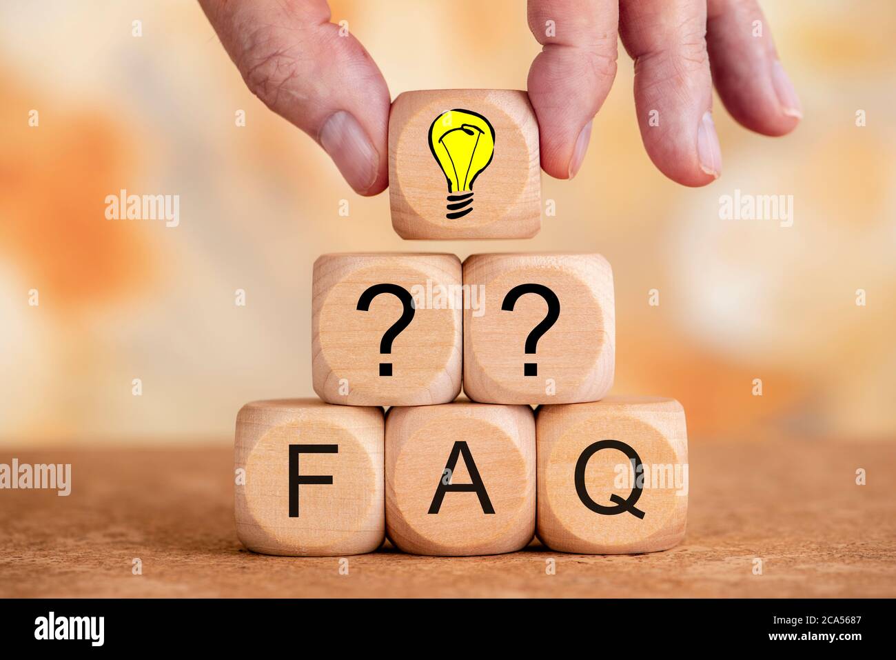 frequently asked questions printed on wooden cubes Stock Photo