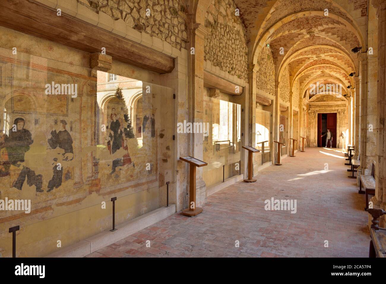 France, Aisne, Thierache,Saint Michel, abbey, walking alley in the cloister with frescoes of the life of Saint Benedict in restoration Stock Photo