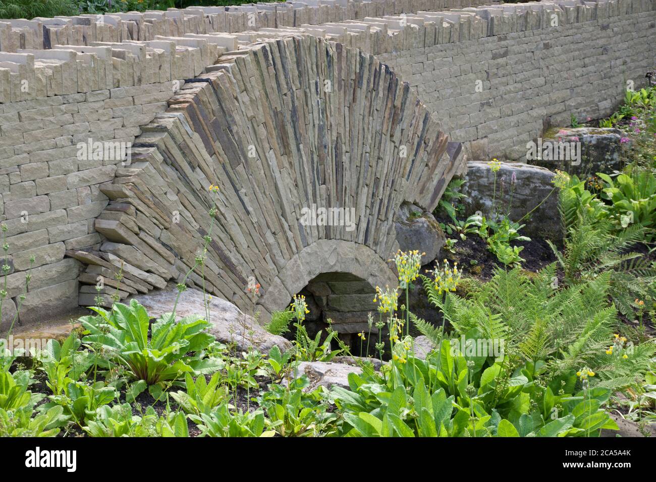Drystone arched bridge at Harlow Carr Gardens Stock Photo