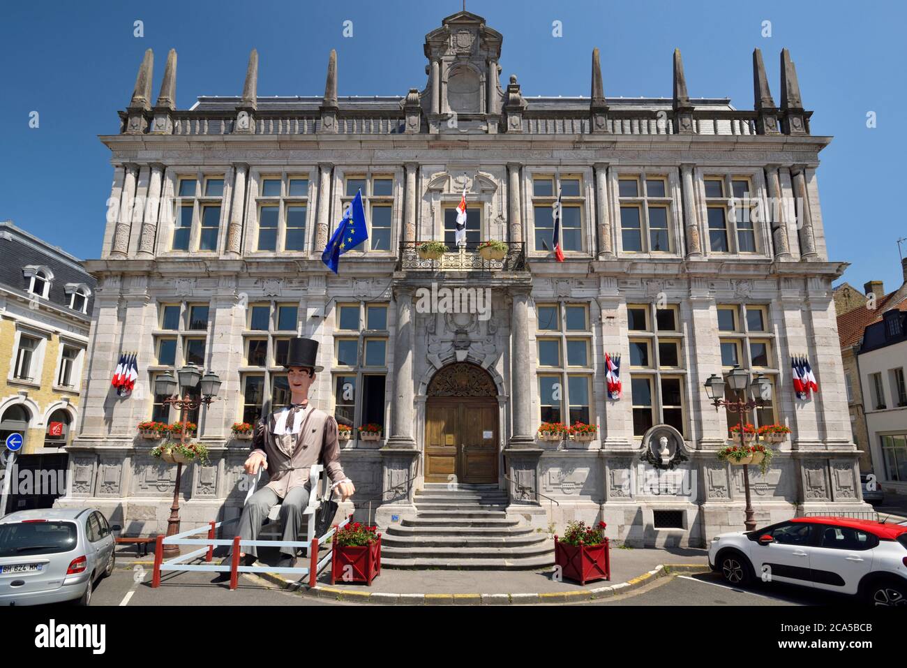 France, Nord, Bergues, the Town Hall and the giant called Electeur de Lamartine, recalling that Lamartine was deputy of Bergues from 1833 to 1837 Stock Photo