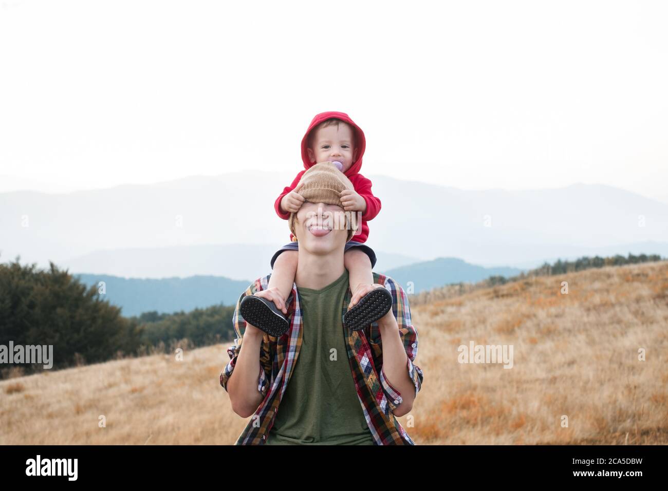 Brothers in autumn mountains. Childhood and brotherhood concept Stock Photo
