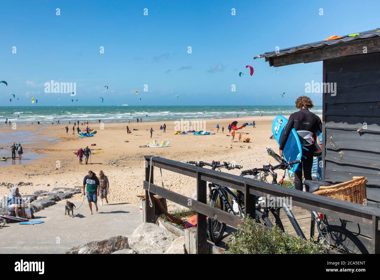 France, Pas de Calais, Wissant, beach cottage by the beach, kitesurfing on the sea Stock Photo