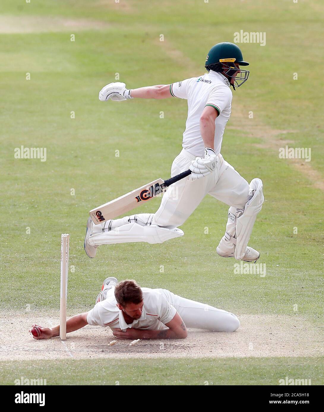 Leicestershire's Ben Slater jumps over Lancashire's Tom Bailey as he fails in an attempt to run him out during day four of the Bob Willis Trophy match at Blackfinch New Road, Worcester. Stock Photo