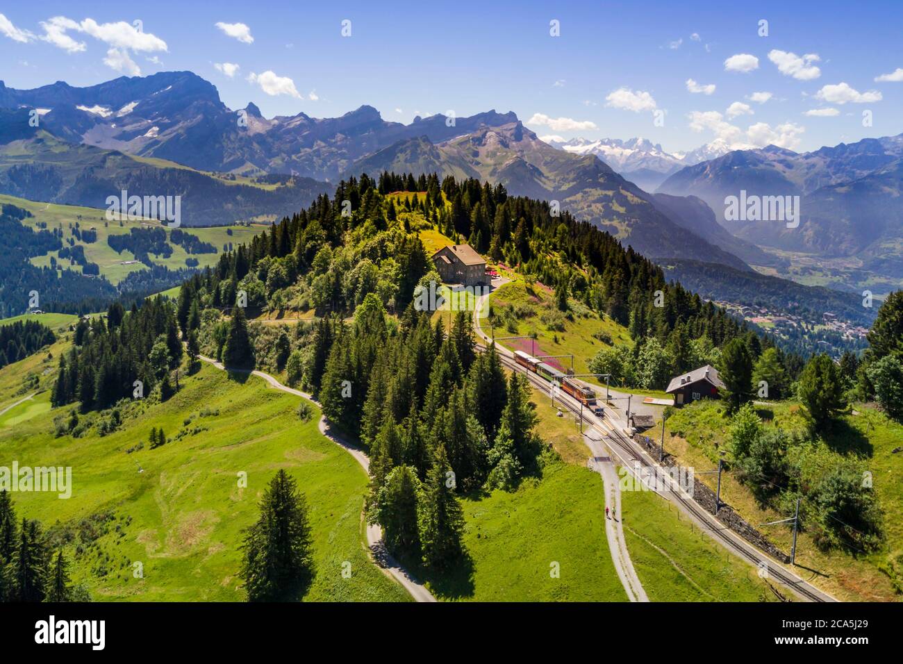 Switzerland, Canton of Vaud, Villars-sur-Ollon, train to the Bretaye pass station at the Bouquetins station and Mont-Blanc in the background (aerial view) Stock Photo