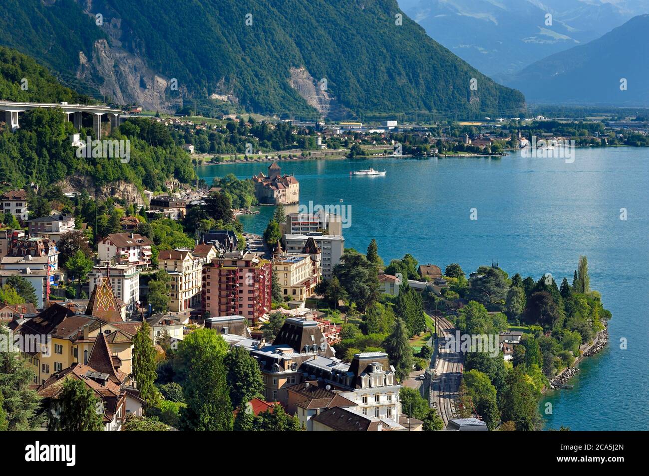 Switzerland, Canton of Vaud, Montreux in the foreground and the Chillon castle on the shores of Lake Geneva (Lac Leman) at Veytaux Stock Photo