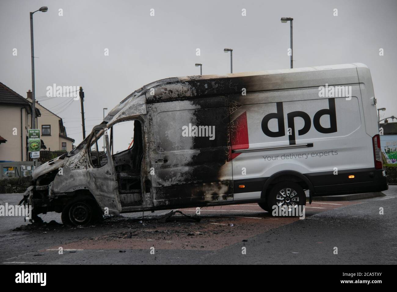 Burned out Van in Derry's Creggan estate near the home of the recentyl deceased John Hume. Stock Photo