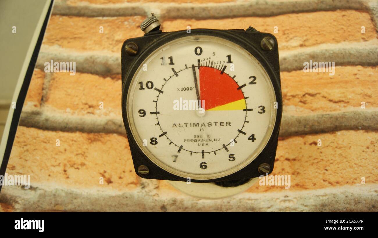 Altimeter, used by skydiver, altitude measuring device, vintage, with black  case, internal dial in white and red color on wall background with exposed  Stock Photo - Alamy